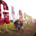 The sun sets behind the famous Glastonbury sign while the site was still green. Photo: Andy Whitton/NME